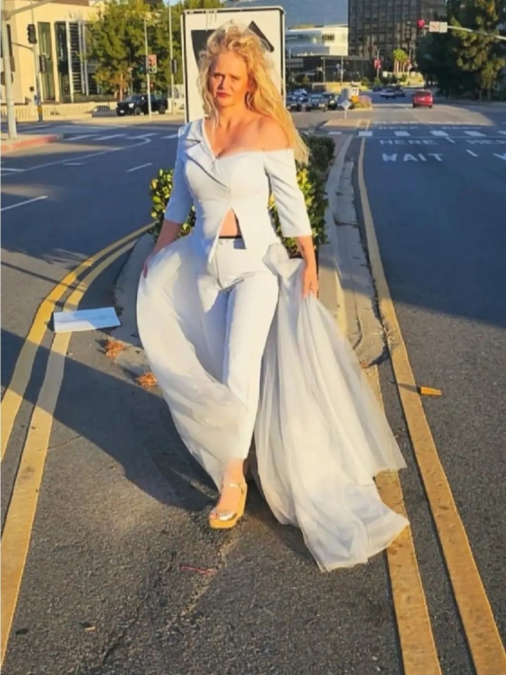 Elegant Off-Shoulder White Jumpsuit with Sheer Train
